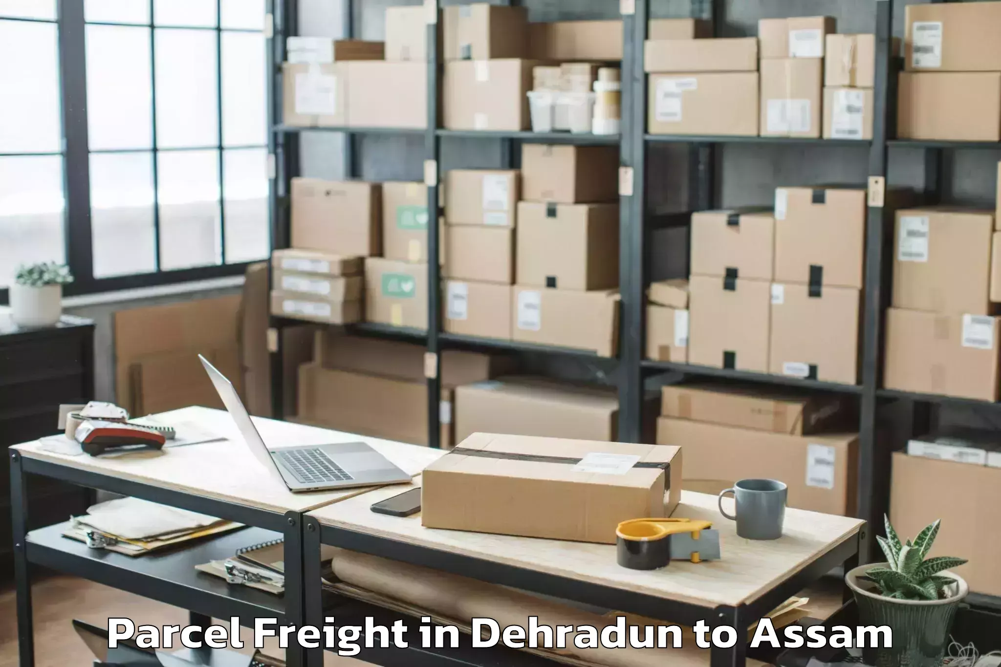 Book Dehradun to Dhekiajuli Parcel Freight Online